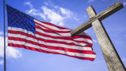 An American flag and a cross.
